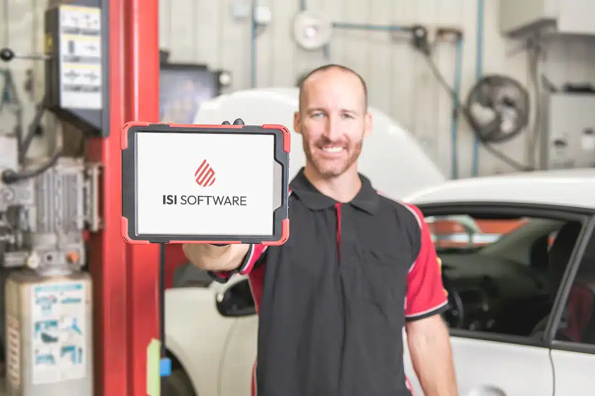 mechanic holding tablet facing camera