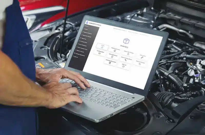person using laptop with lubesoft express software on screen