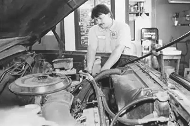 Old Photo Of Mechanic Changing Oil Of Vehicle old photo of mechanic changing oil of vehicle