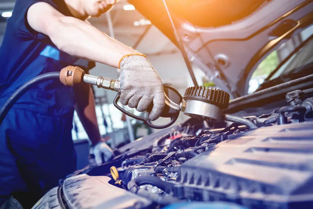 Oil Change Tech Filling Car Oil oil change tech filling car oil